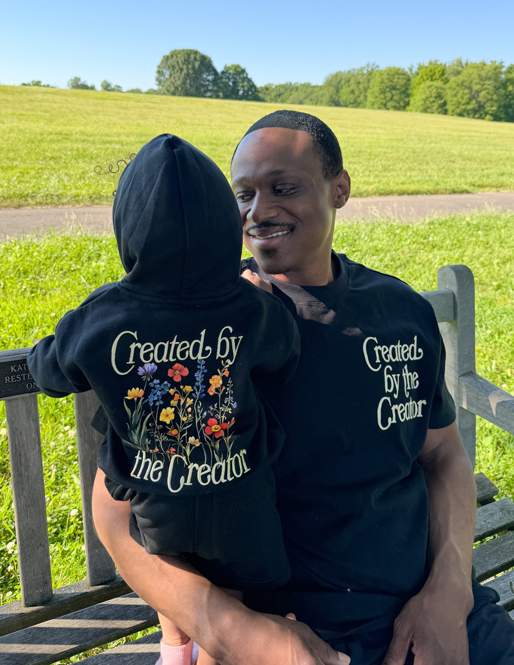 Kids black hoodie with back floral “Created by the Creator” graphic