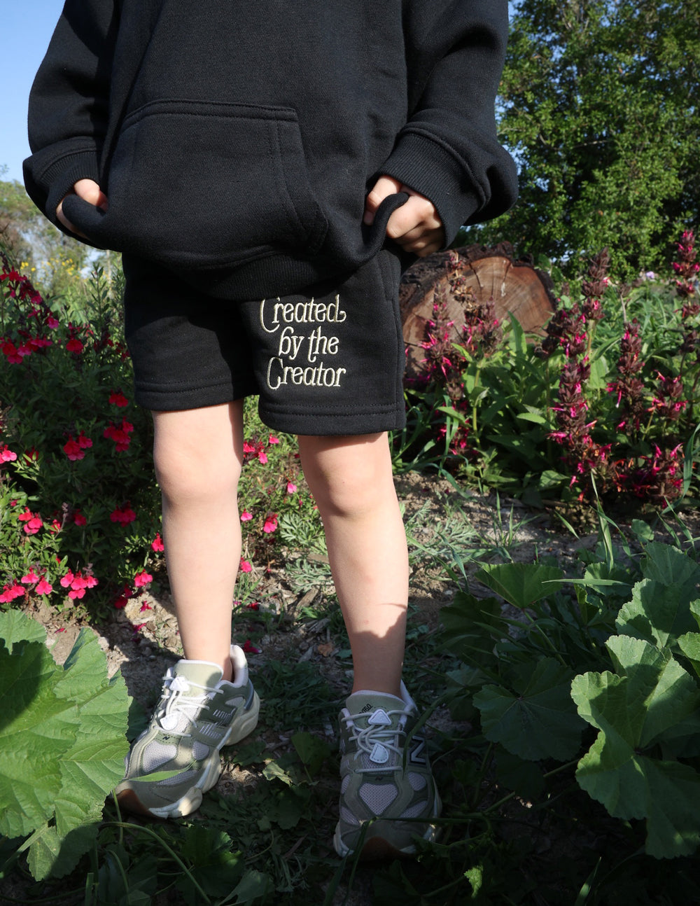 Kids dark shorts with elastic waistband and Created by the Creator logo
