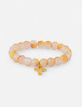 Beaded cross charm bracelet with peach and white swirl beads and gold cross pendant
