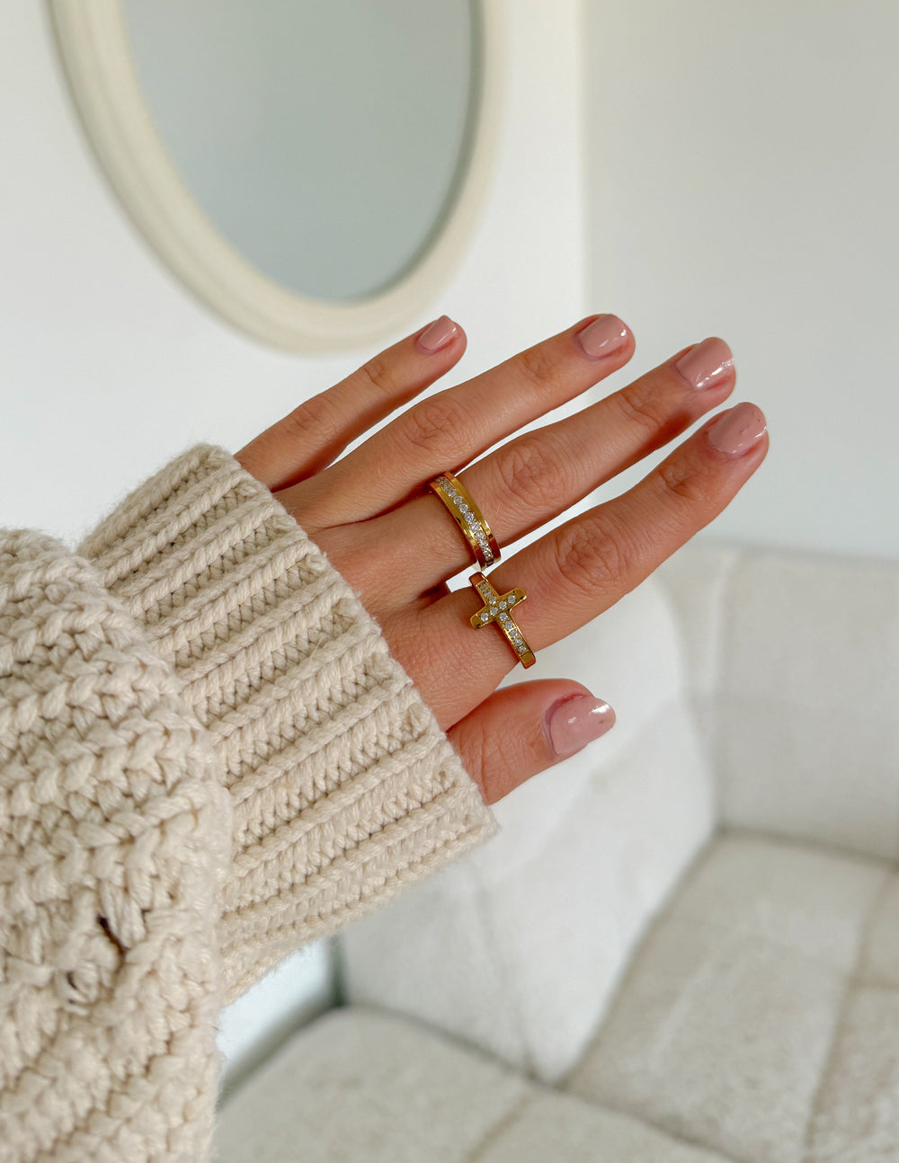 Gold cross gem ring with clear stones on two stacked bands