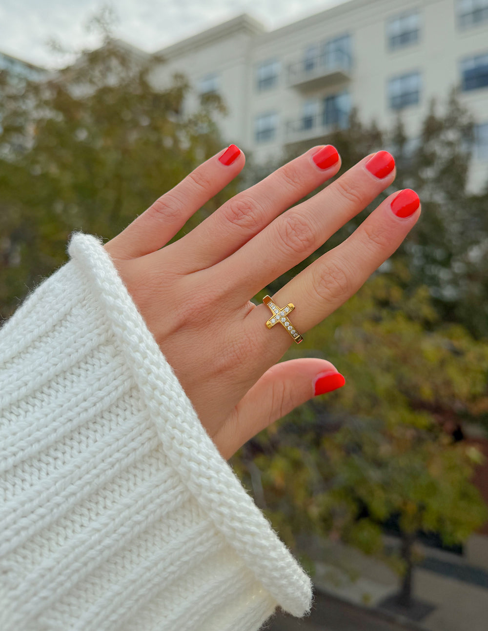 Gold cross gem ring with clear stone accents