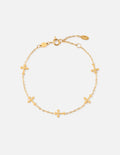 Gold cross link bracelet with toggle clasp and small cross charms.