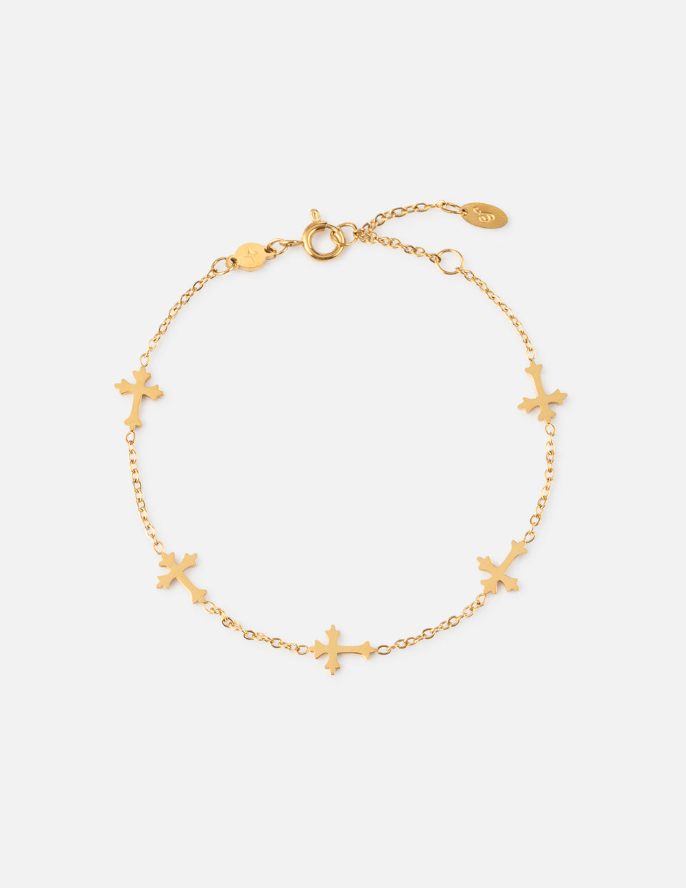 Gold cross link bracelet with toggle clasp and small cross charms.