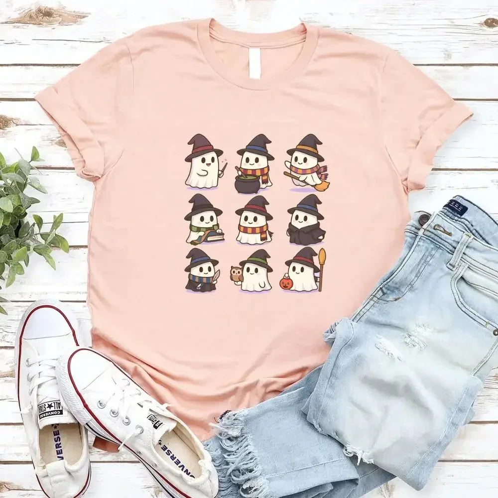 Light pink Halloween T-shirt featuring a grid of cute witch and ghost characters