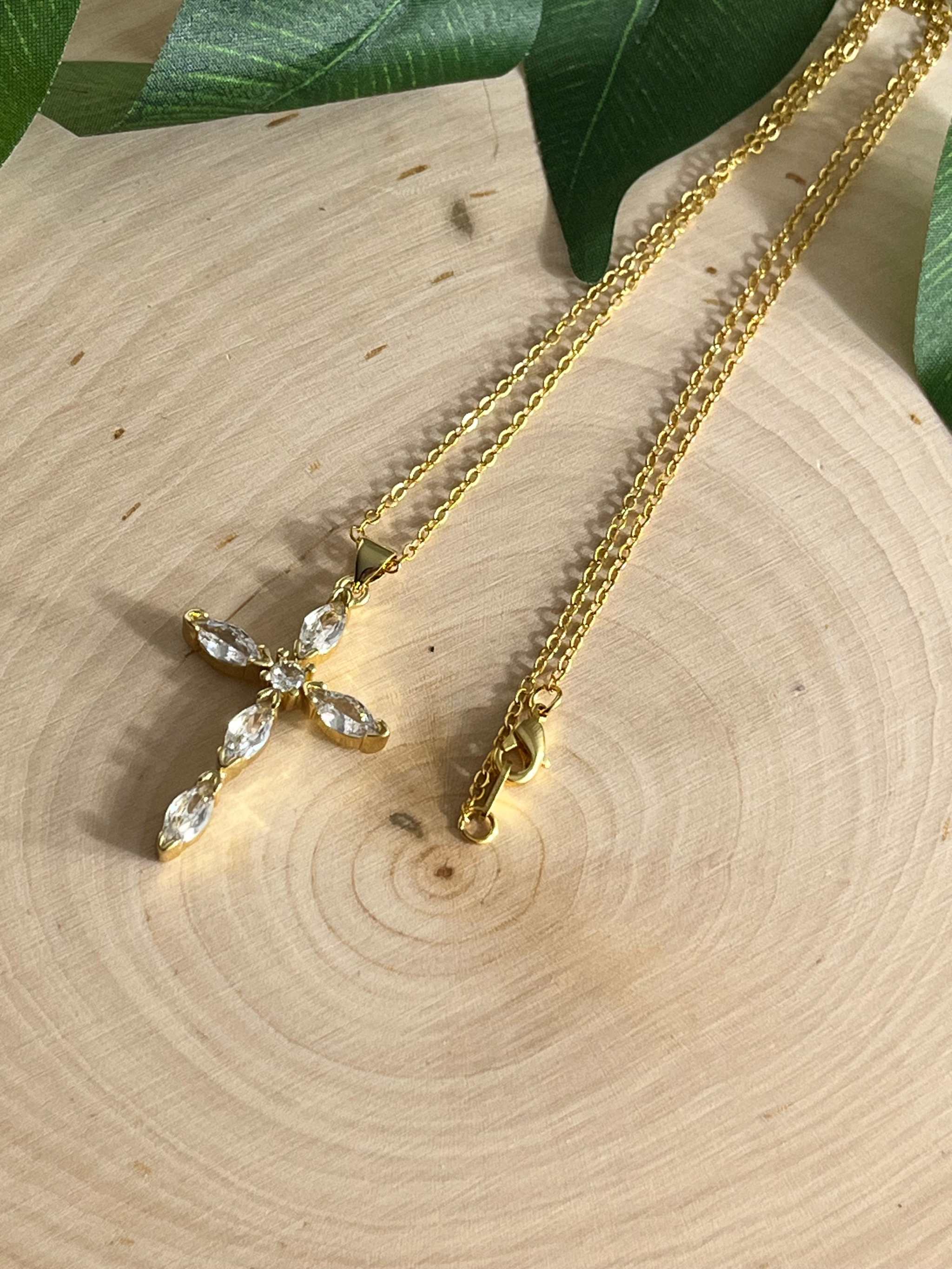 Gold cross pendant necklace with clear crystal cross and two chain views