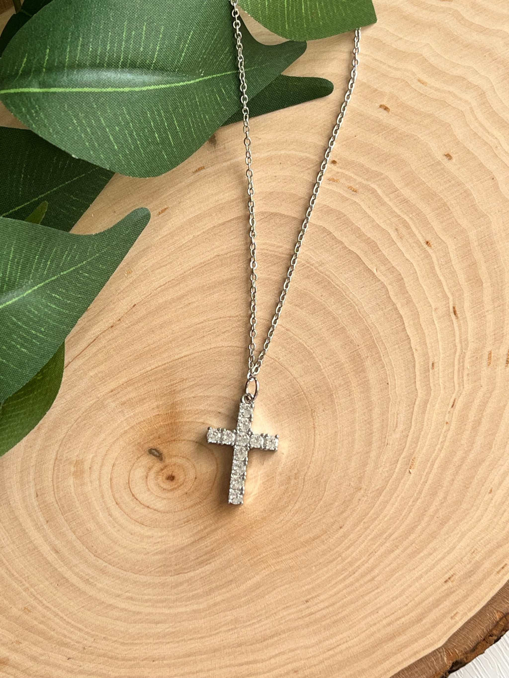 Silver cross pendant necklace with glittery rhinestone cross and chain