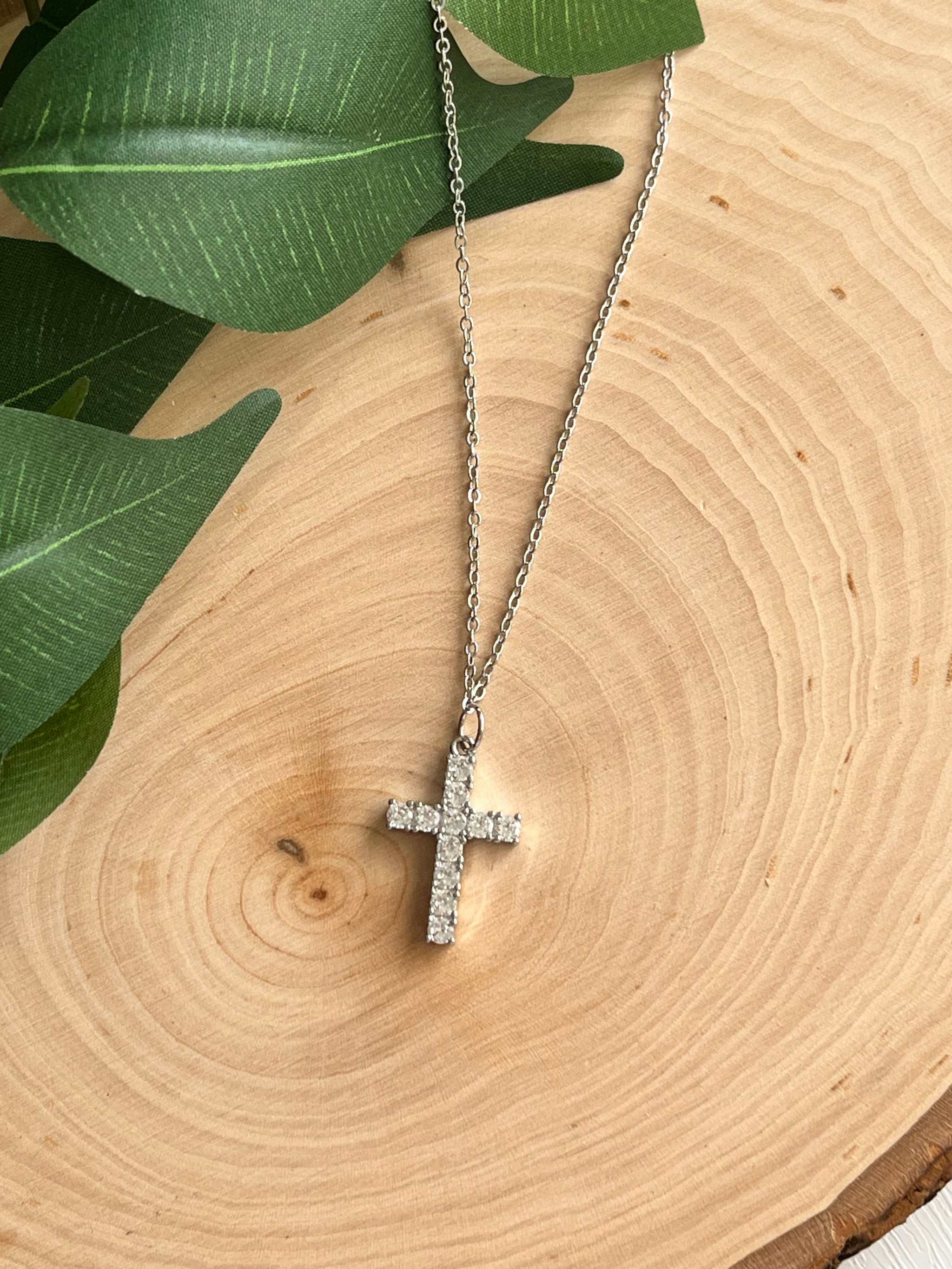 Silver cross pendant necklace with glittery rhinestone cross and chain