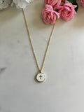 Gold cross pendant necklace with round locket and slim chain