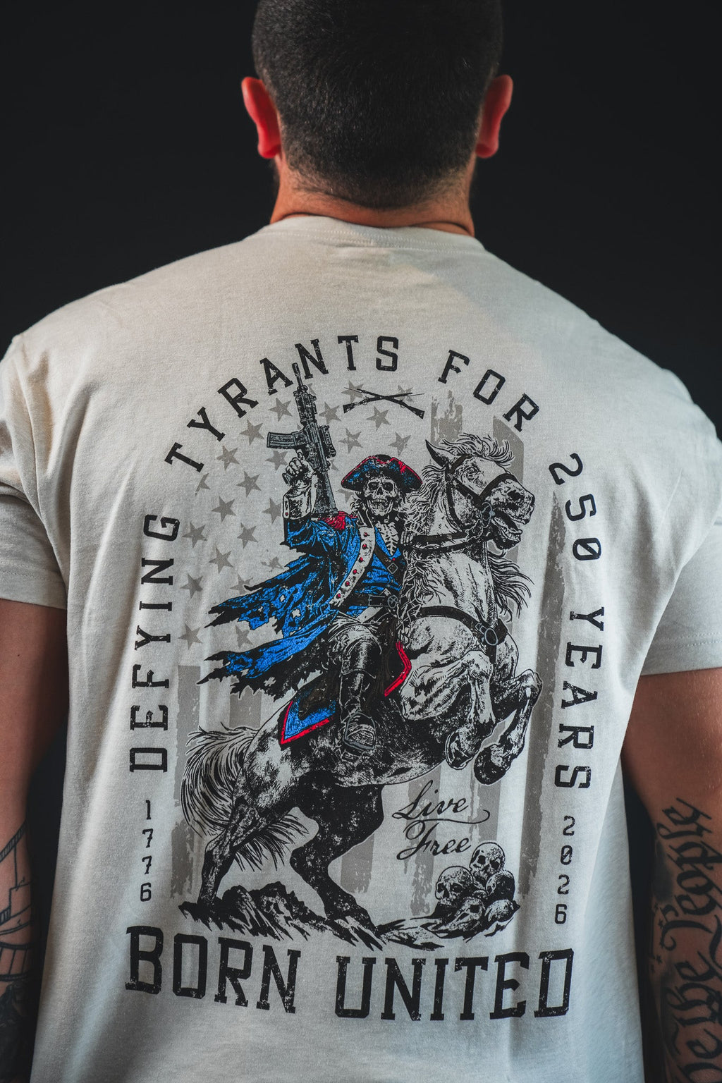 Light gray graphic back T-shirt featuring “Dieying Grants for U.S. Years” and riders
