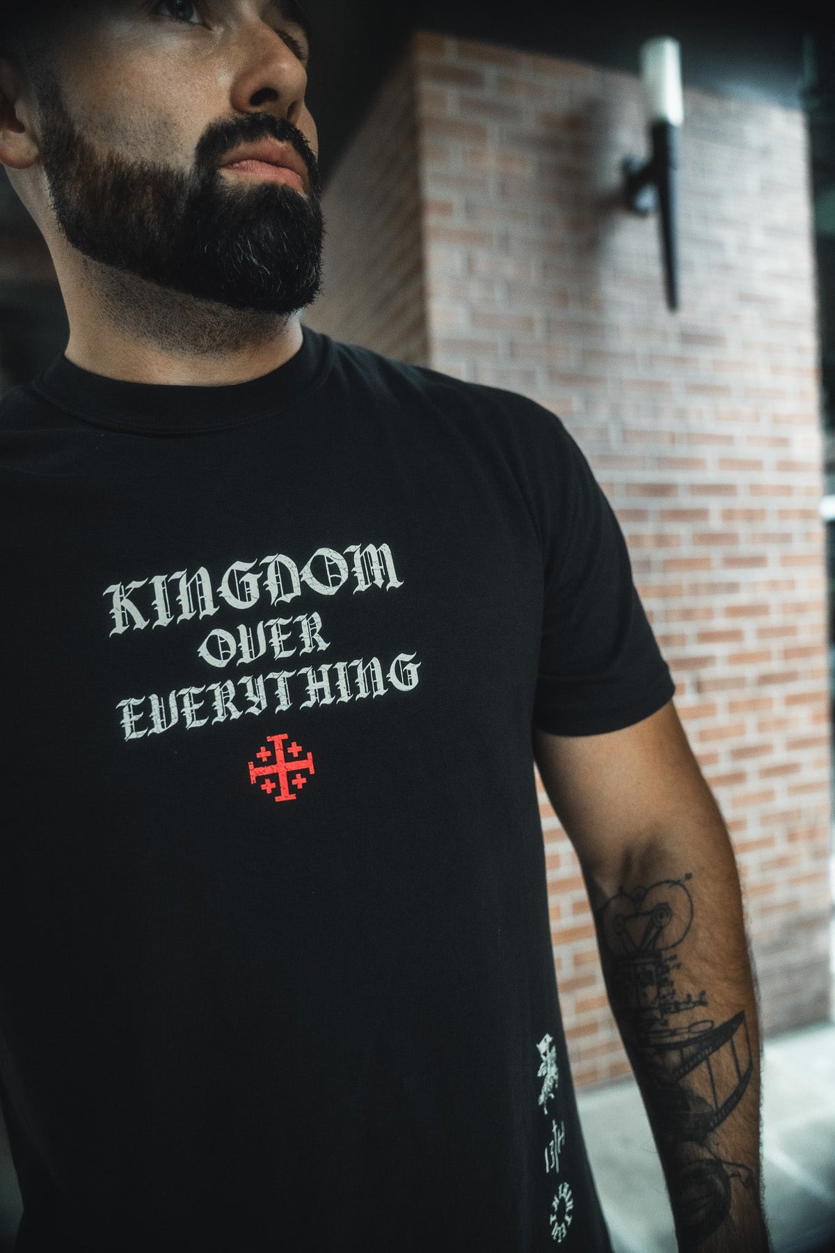 Black crew-neck tee with large chest graphic in white and red