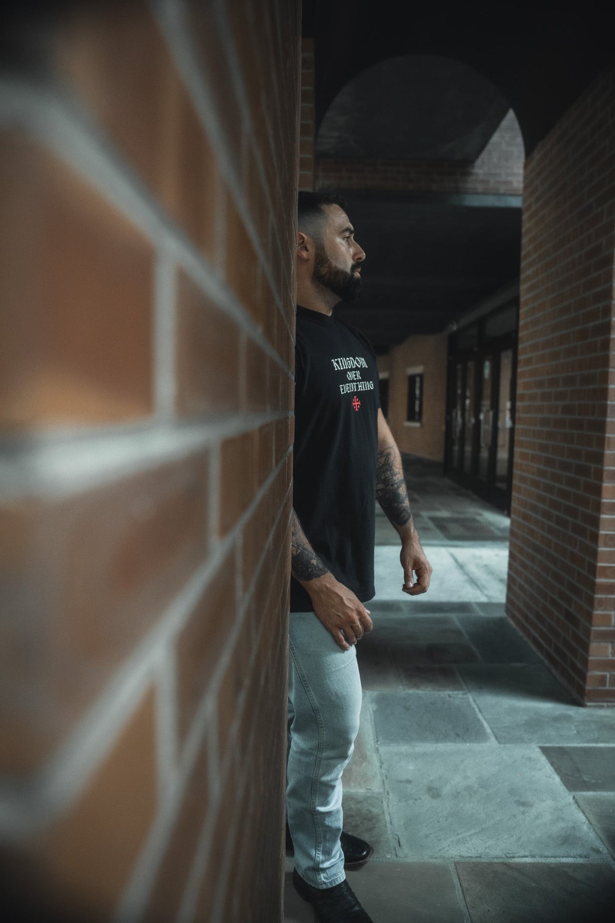Black tee with chest graphic print, crew neck and short sleeves with light jeans