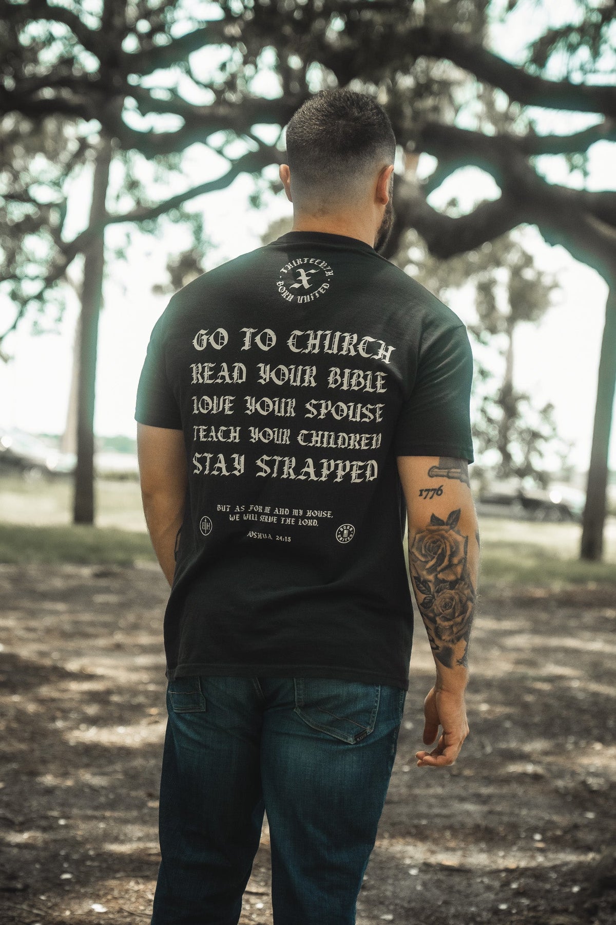 Black T-shirt showing back slogan: Go to Church, Read Your Bible, Teach Your Children.