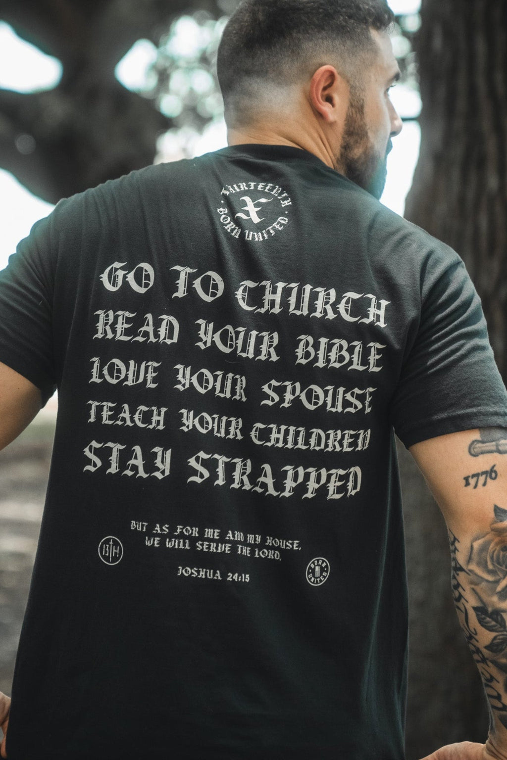 Black T-shirt with large back graphic text: Go to Church, Read Bible, Stay Strapped.