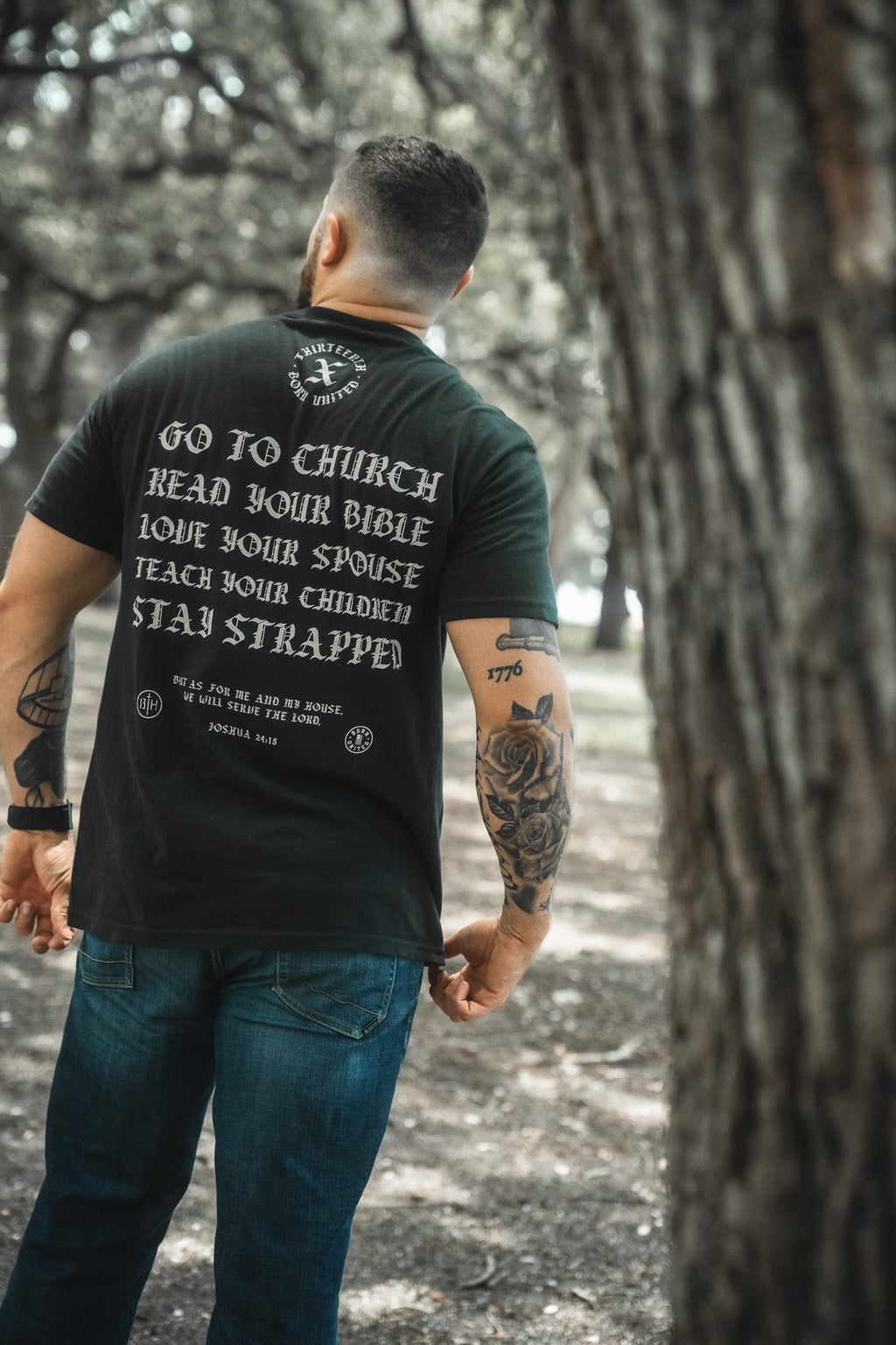 Black T-shirt back text and circular emblem: Go to Church and Read Your Bible.