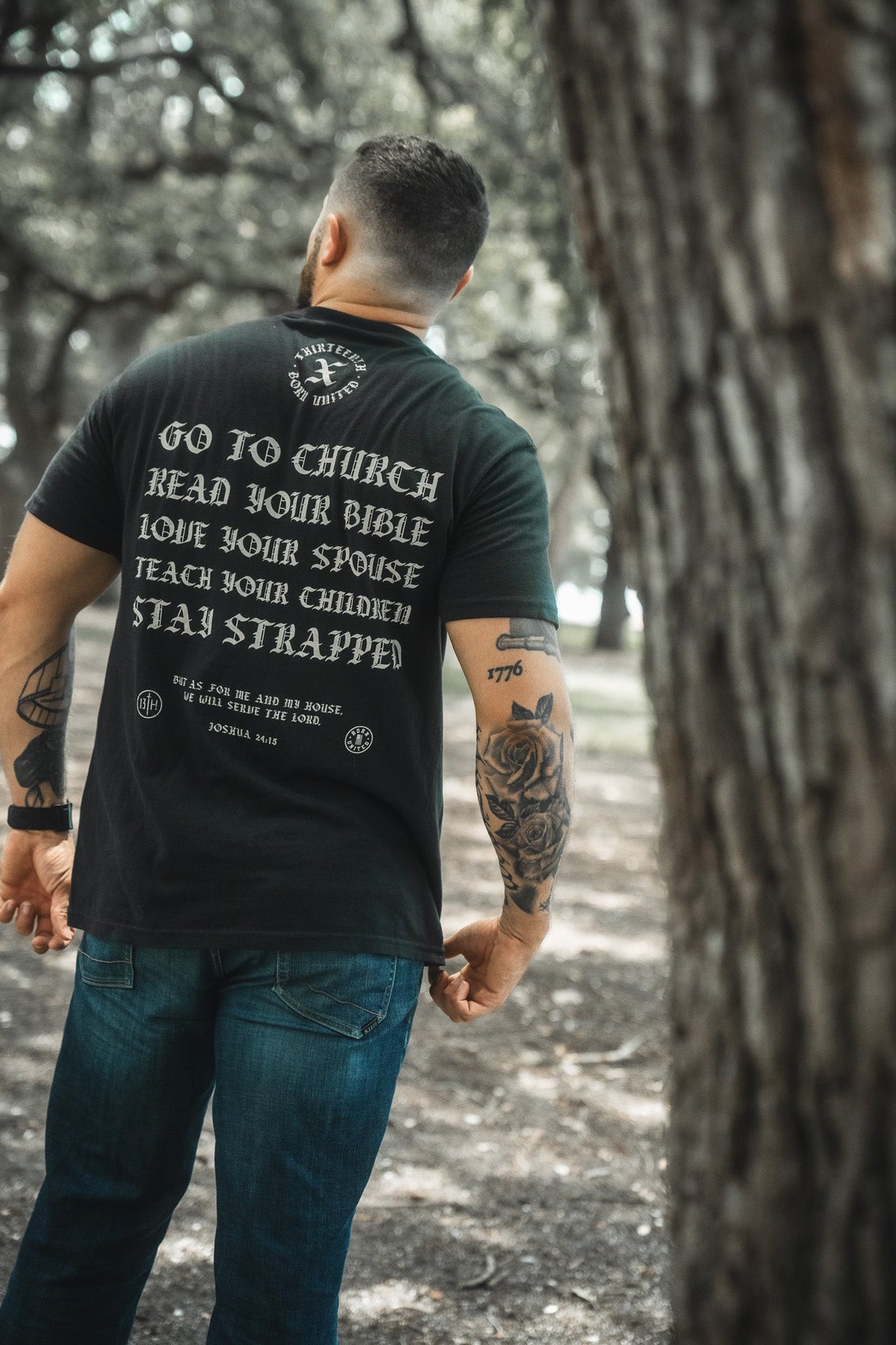 Black T-shirt back text and circular emblem: Go to Church and Read Your Bible.