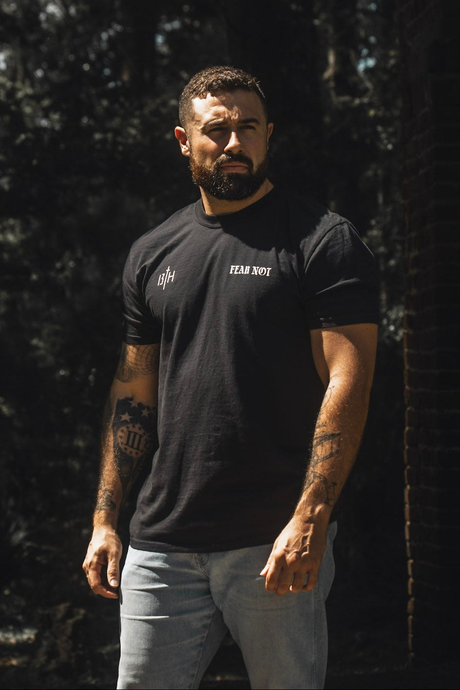 Black premium tee with small chest “FEAR NOT” logo, short sleeves
