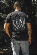 Black premium tee with large back “FEAR NOT” graphic text