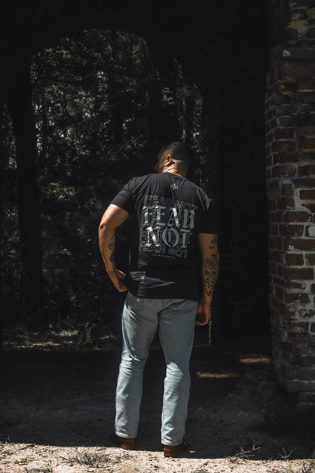 Black premium tee with large back “FEAR NOT” print, crew neck