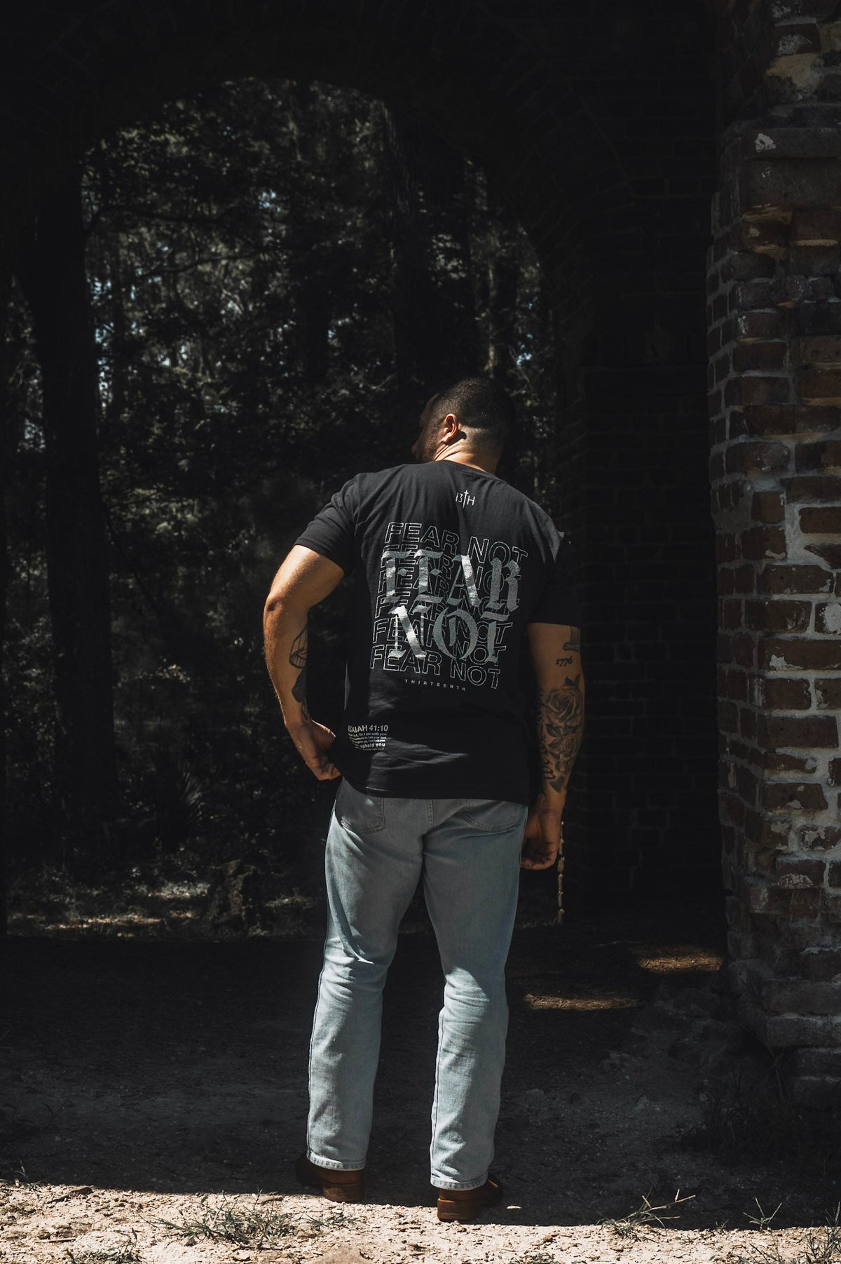 Black premium tee with large back “FEAR NOT” print, crew neck