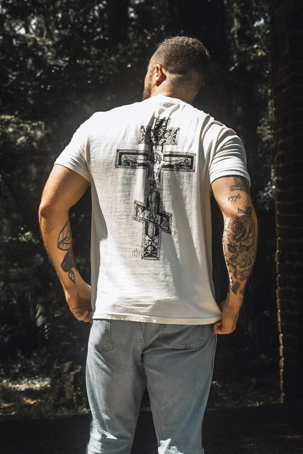 White premium tee back view with large cross graphic