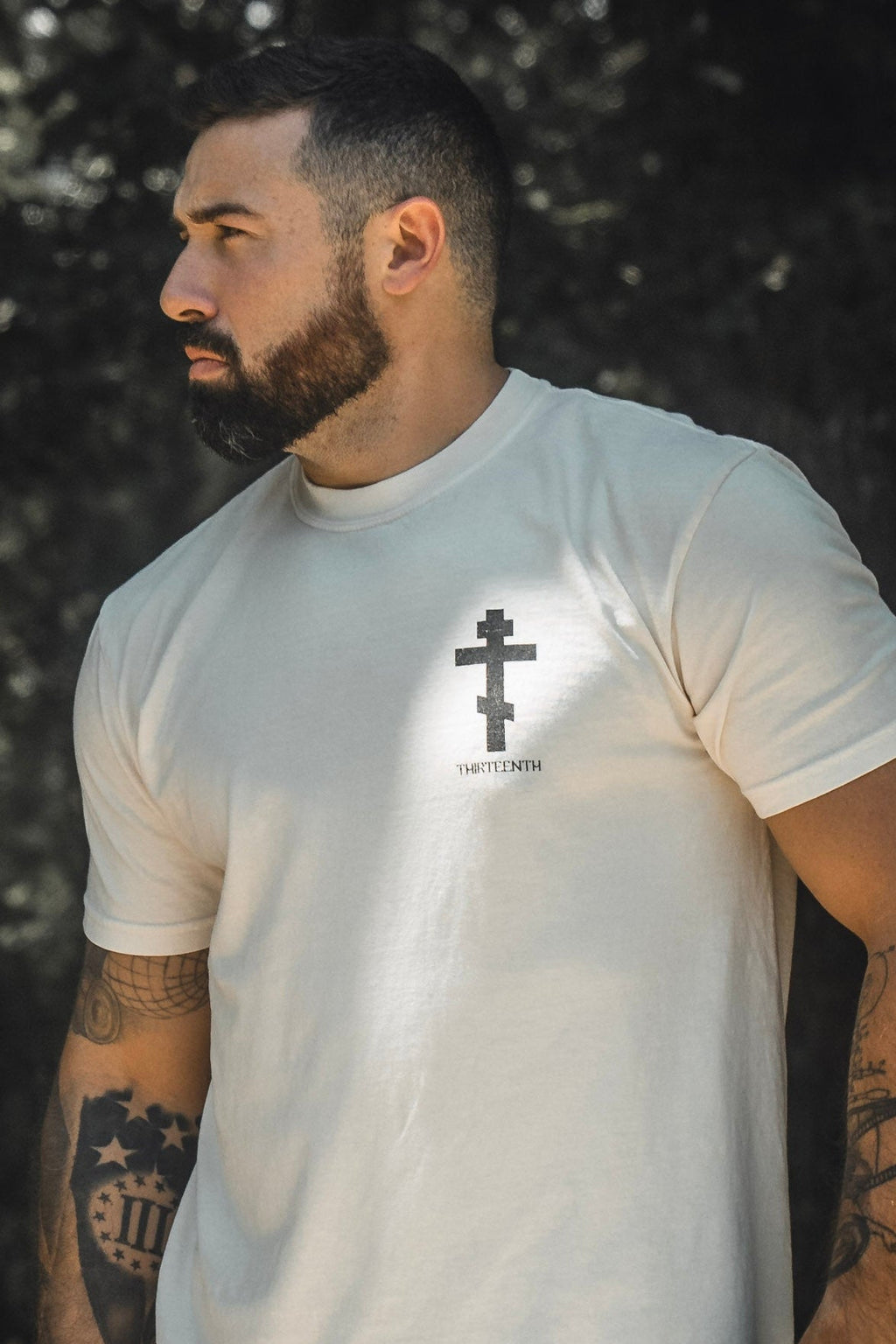 White premium tee with small chest cross logo