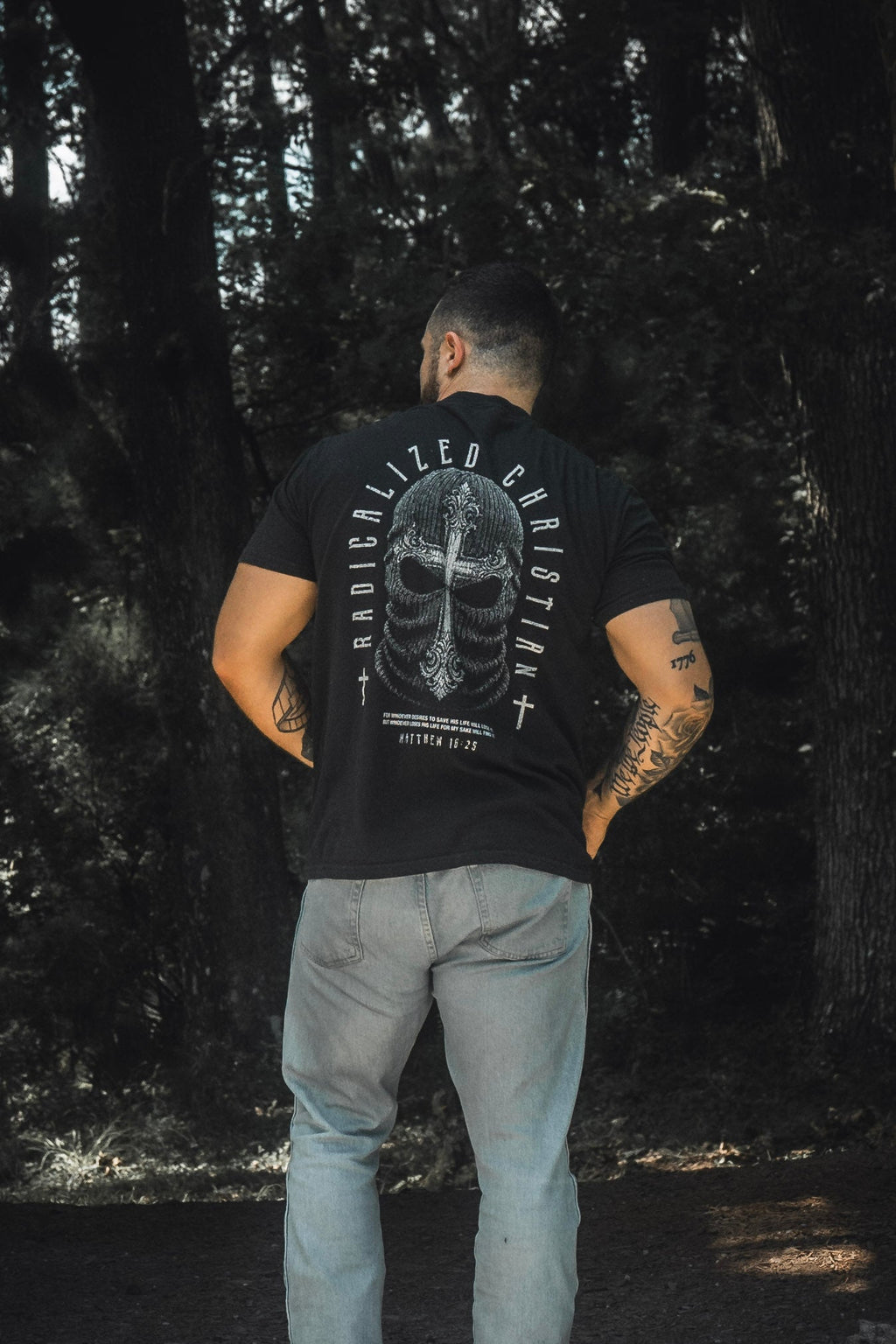 Black premium tee with large back skull cross graphic and circular text