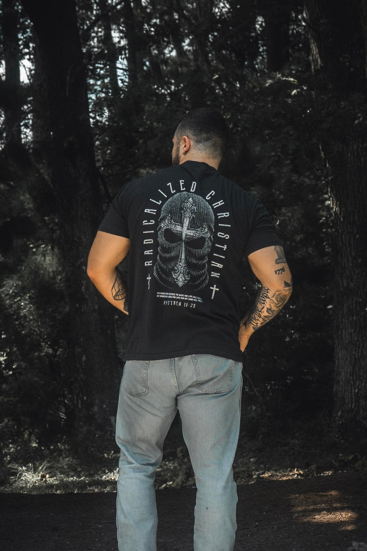 Black premium tee with large back skull cross graphic and circular text