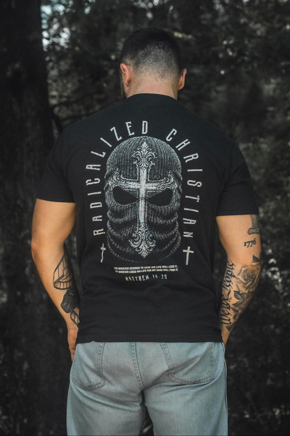Black premium tee with large back skull cross graphic and circular text