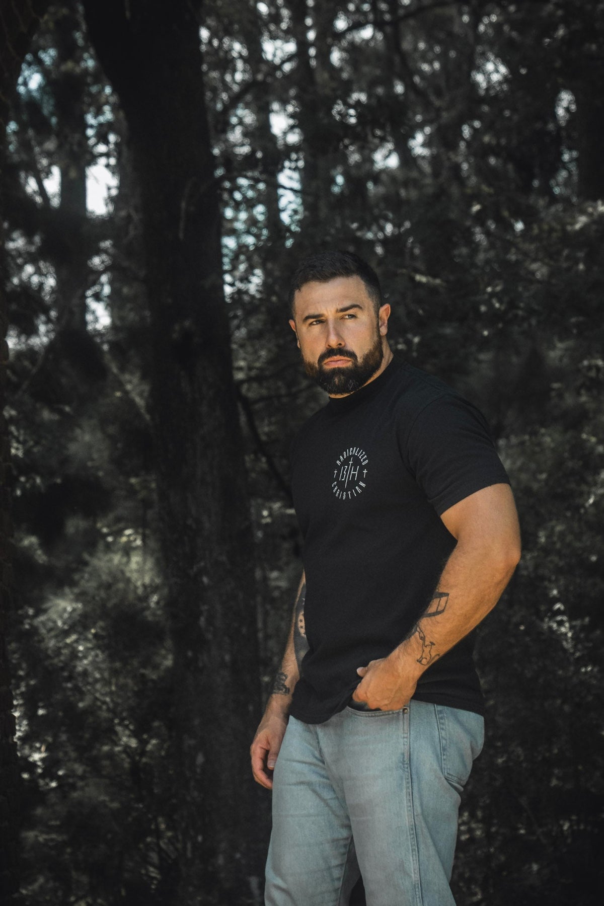 Black premium tee with small front round emblem logo