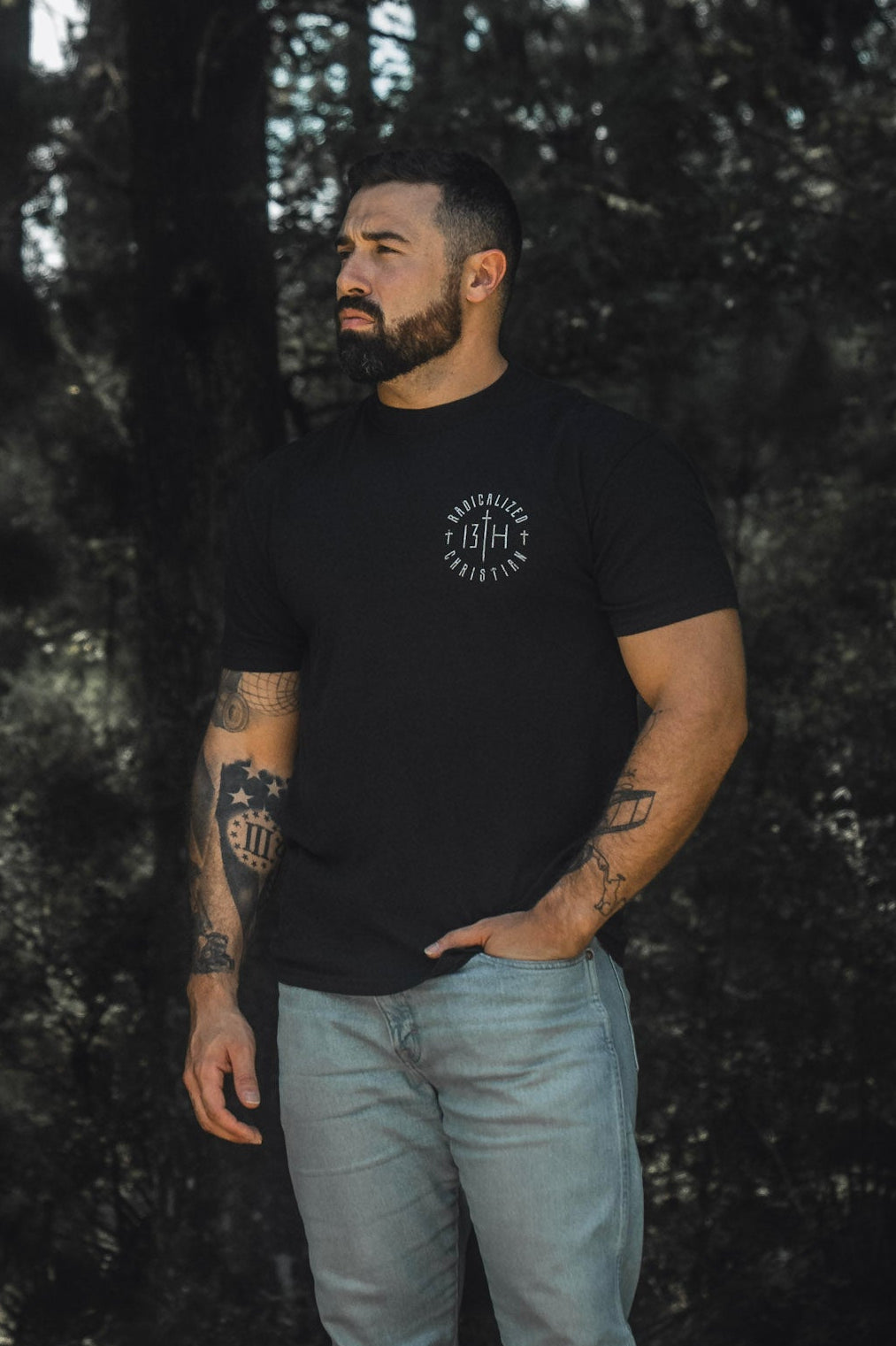 Black premium tee with small front round emblem logo