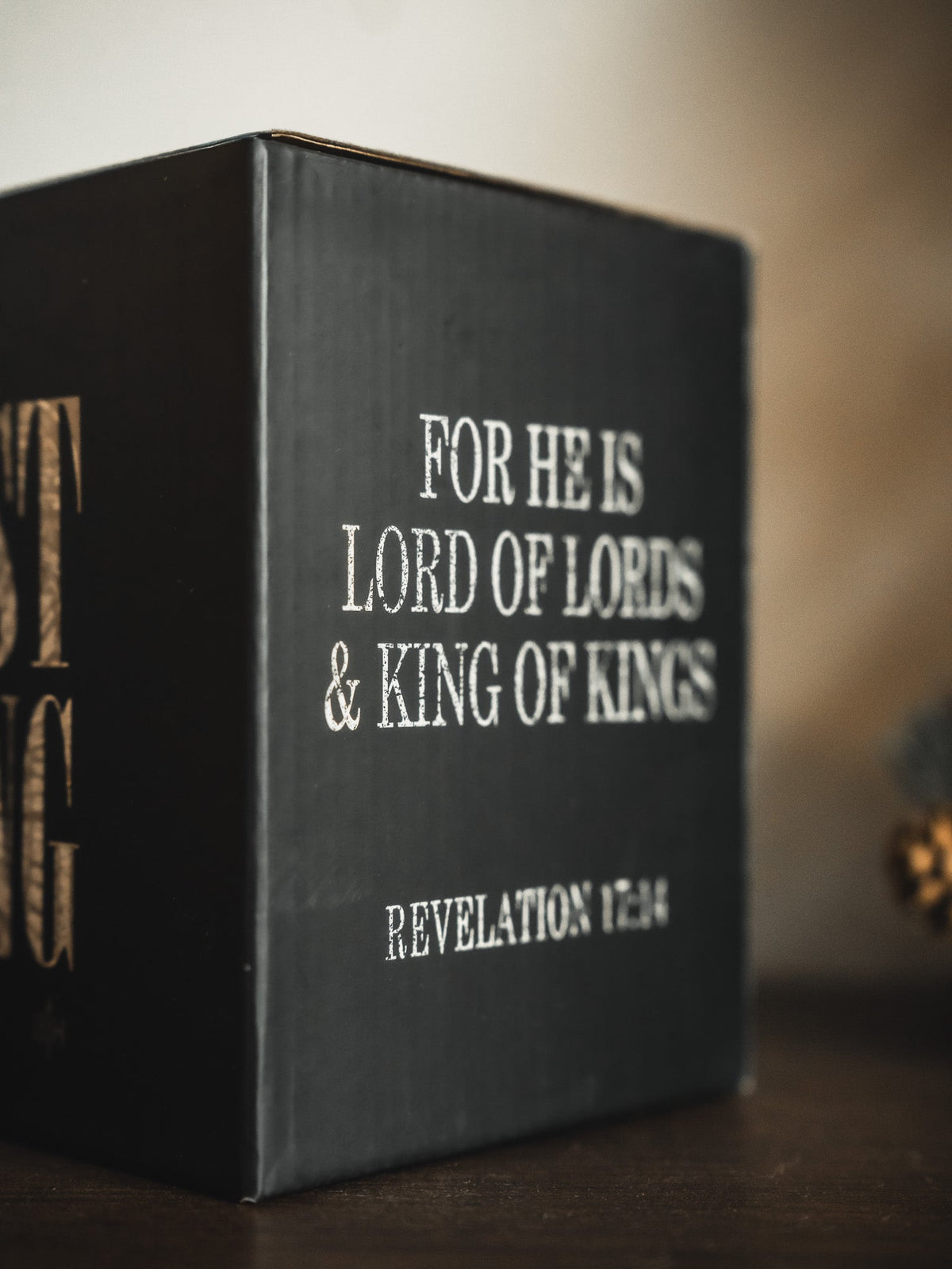 Black gift box panel reading FOR HE IS LORD OF LORDS & KING OF KINGS