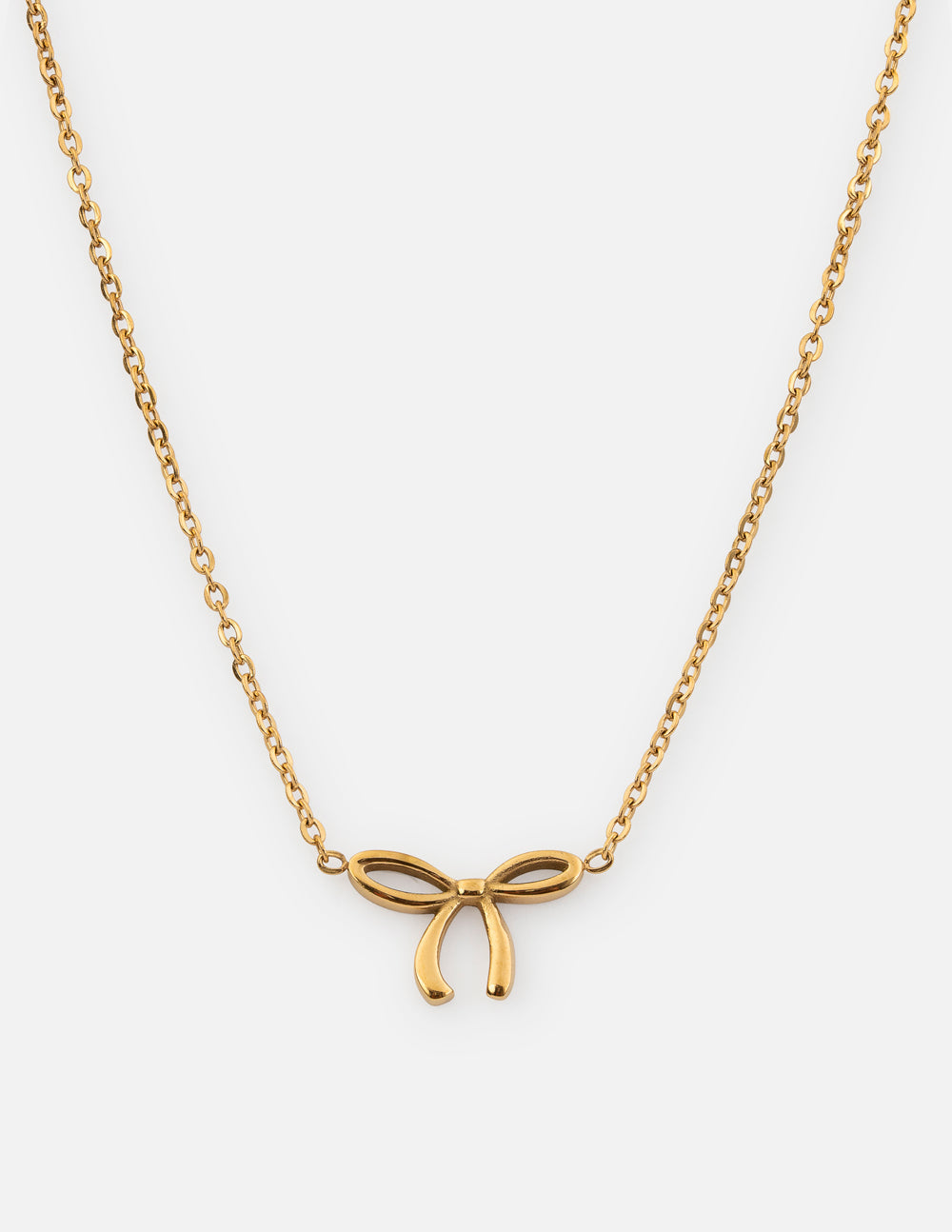 Gold bow pendant necklace with delicate chain and small dangling bow detail
