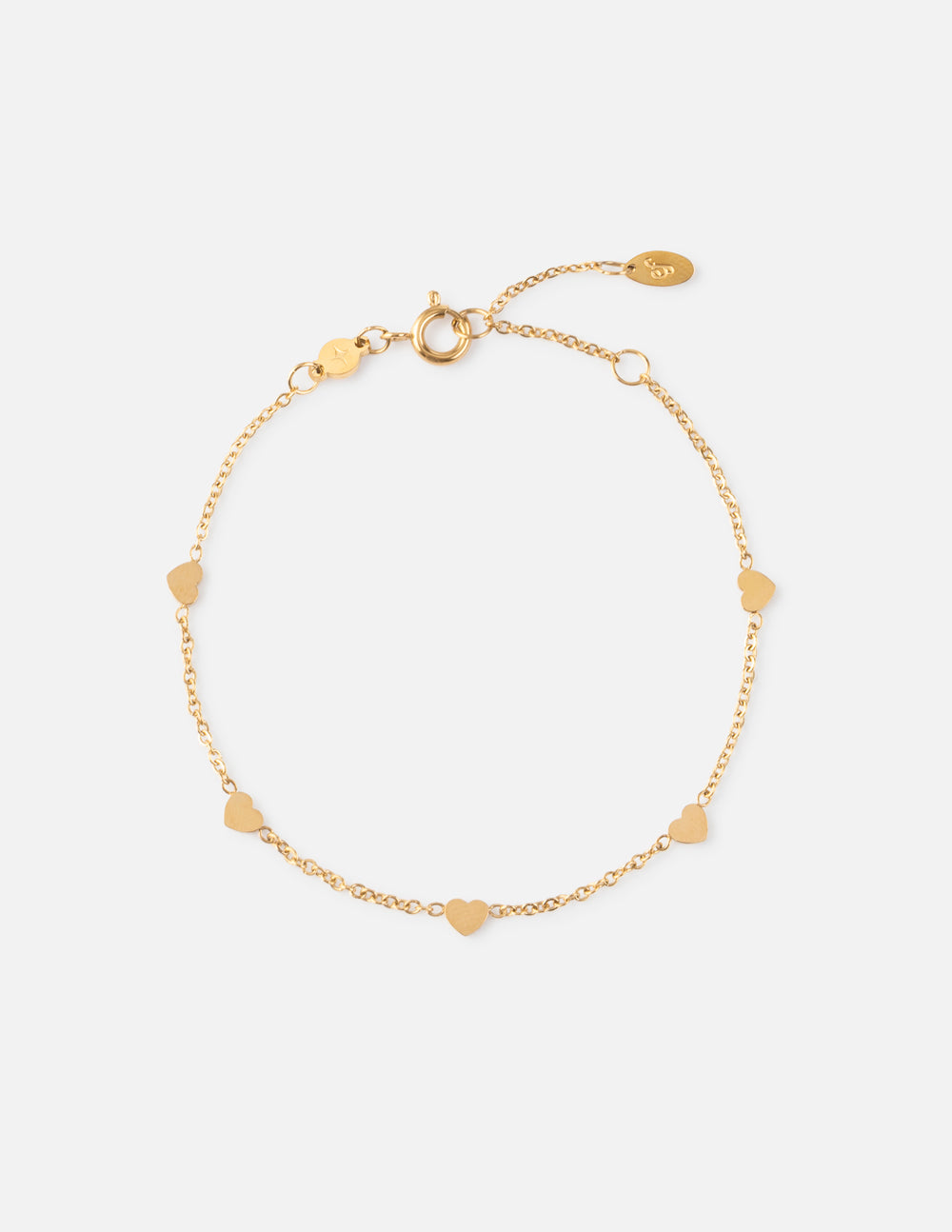 Gold charm bracelet with heart and round beads on a fine chain