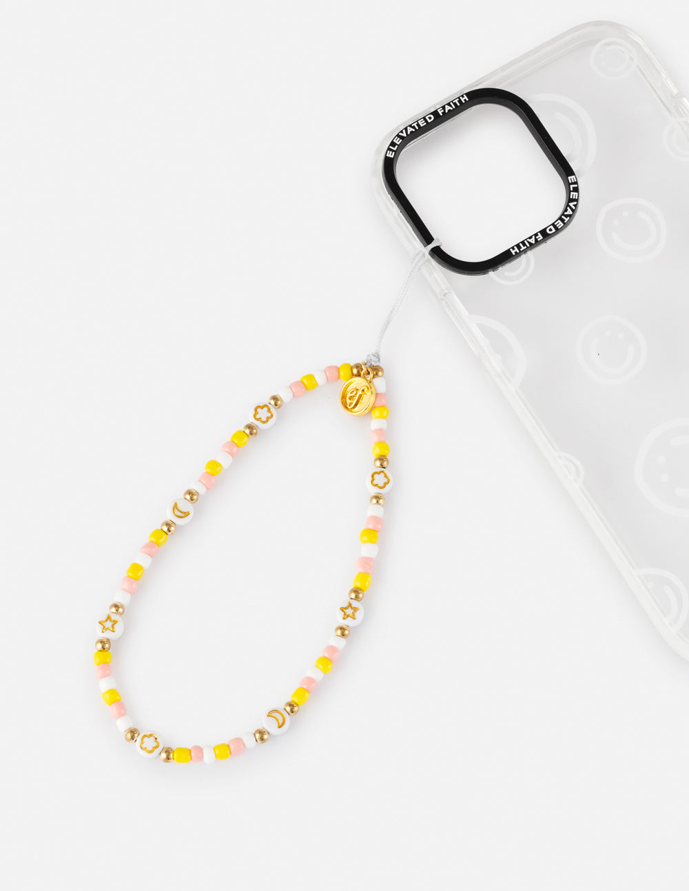 Beaded phone charm lanyard with yellow beads and gold star accents