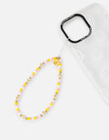 Beaded phone charm lanyard with yellow beads and gold star accents