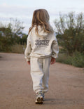 Kids hoodie in off-white with front “Sleepy Loved” heart and star graphic