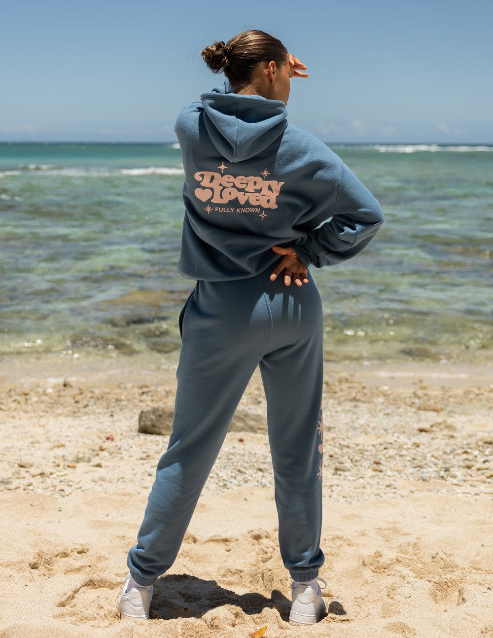 Blue unisex hoodie with hood and centered back logo, kangaroo pocket