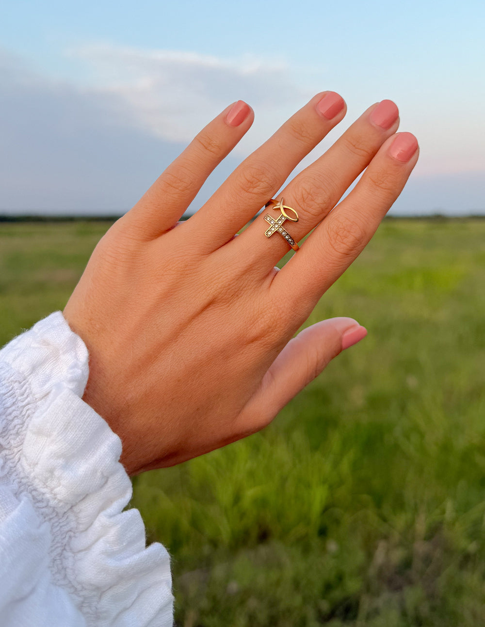 Gold-tone cross ring with clear stones on slim band