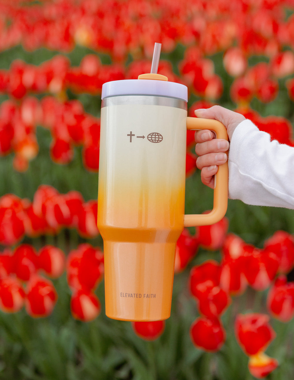 40 oz faith tumbler with orange handle, straw, and cream-to-orange gradient finish