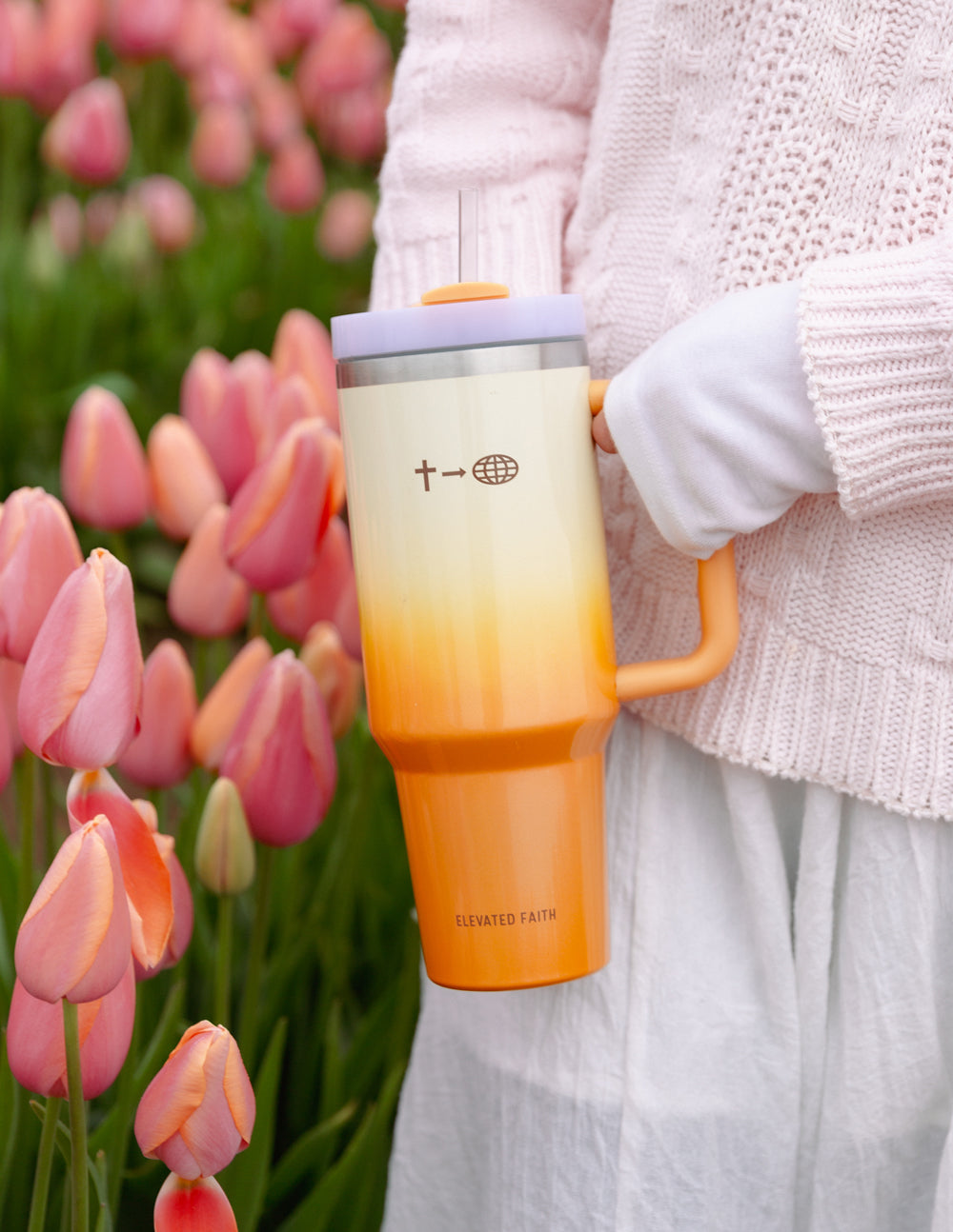 40 oz faith tumbler with orange handle, straw, and cream-to-orange gradient body