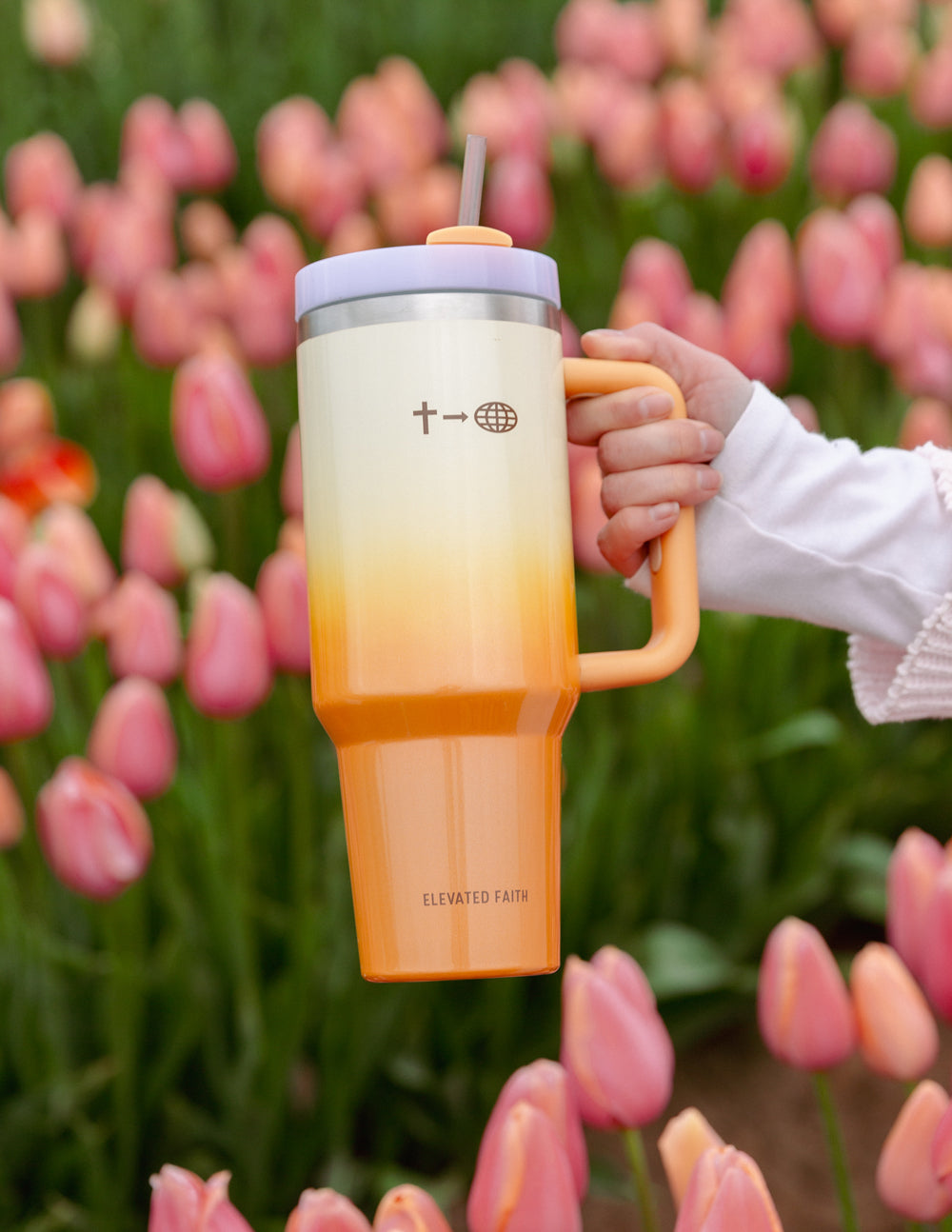 40 oz faith tumbler with silver lid, straw, and cream-to-orange gradient with front logo