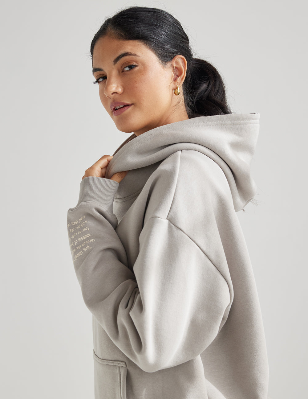 Grey unisex hoodie with hood and kangaroo pocket, side view