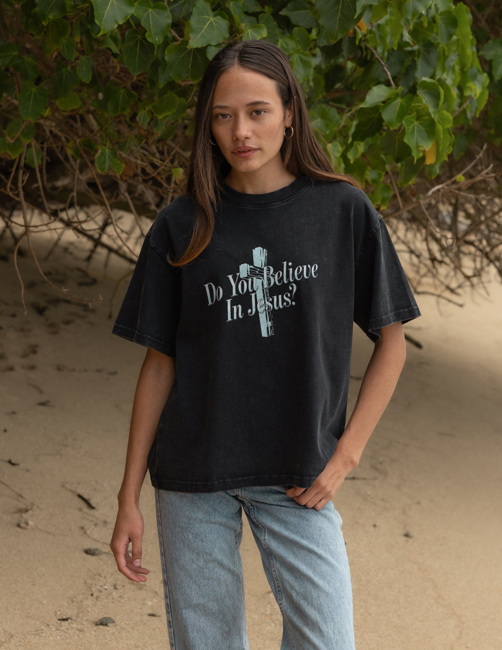 Black crewneck t-shirt with front cross graphic and “Do You Believe In Jesus?” slogan.