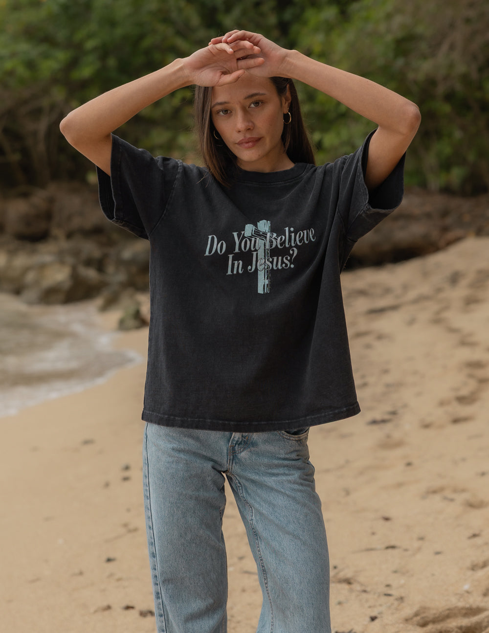 Black crewneck t-shirt with front cross graphic and “Do You Believe In Jesus?” slogan.