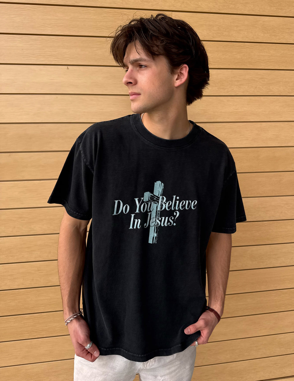 Black crewneck heavyweight tee with front cross graphic and “Do You Believe In Jesus?”.