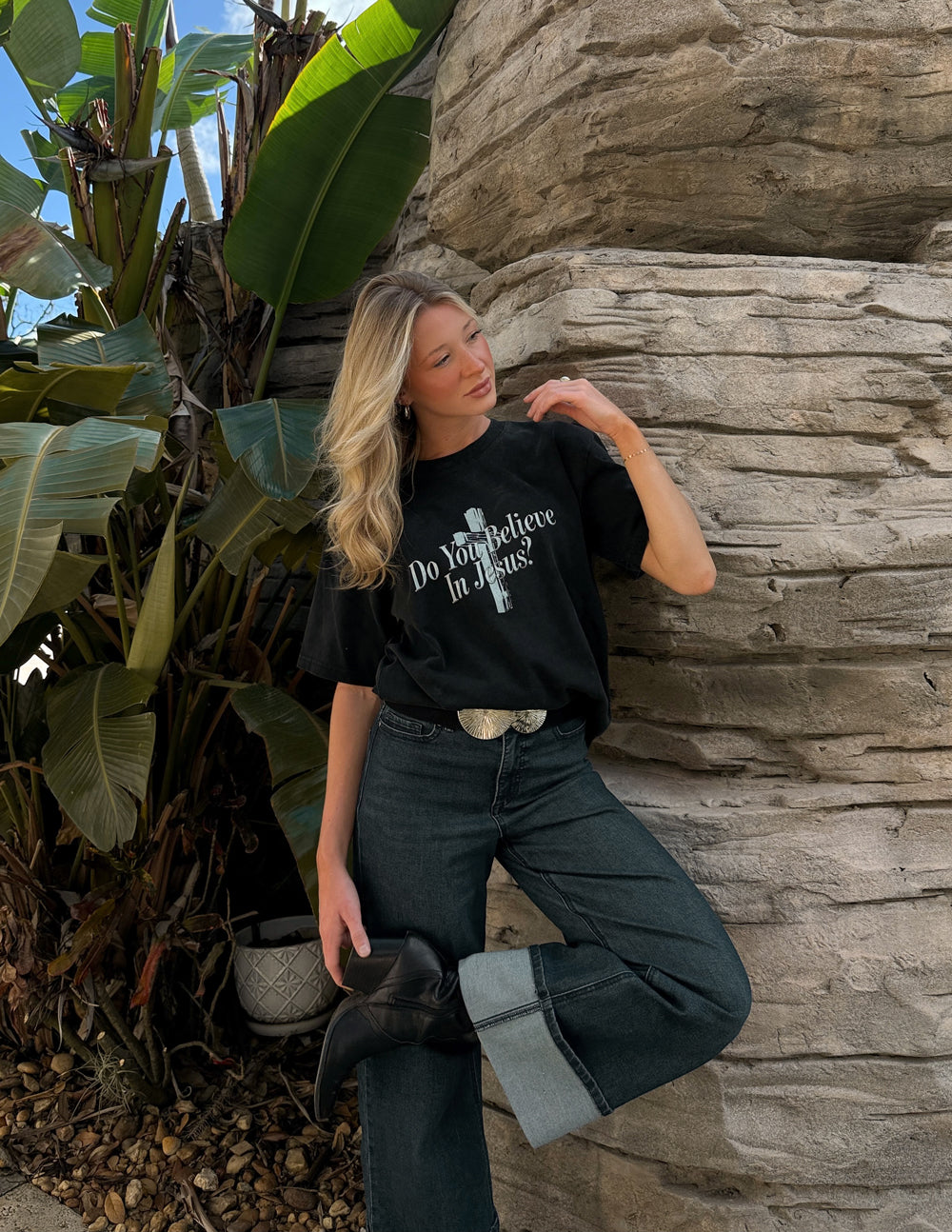 Black crewneck t-shirt with front cross graphic and “Do You Believe In Jesus?” text.