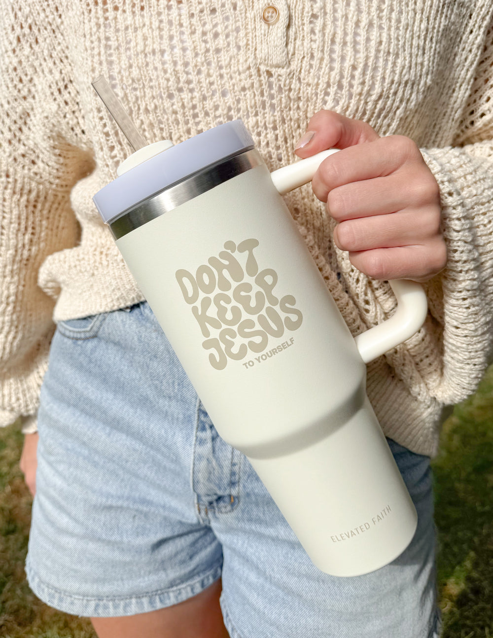 Cream tumbler showing 'Don't Keep Jesus to Yourself' with silver straw lid