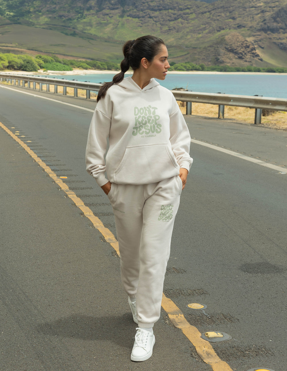 Cream unisex hoodie with green "DON'T KEEP JESUS" graphic, hood and front pocket