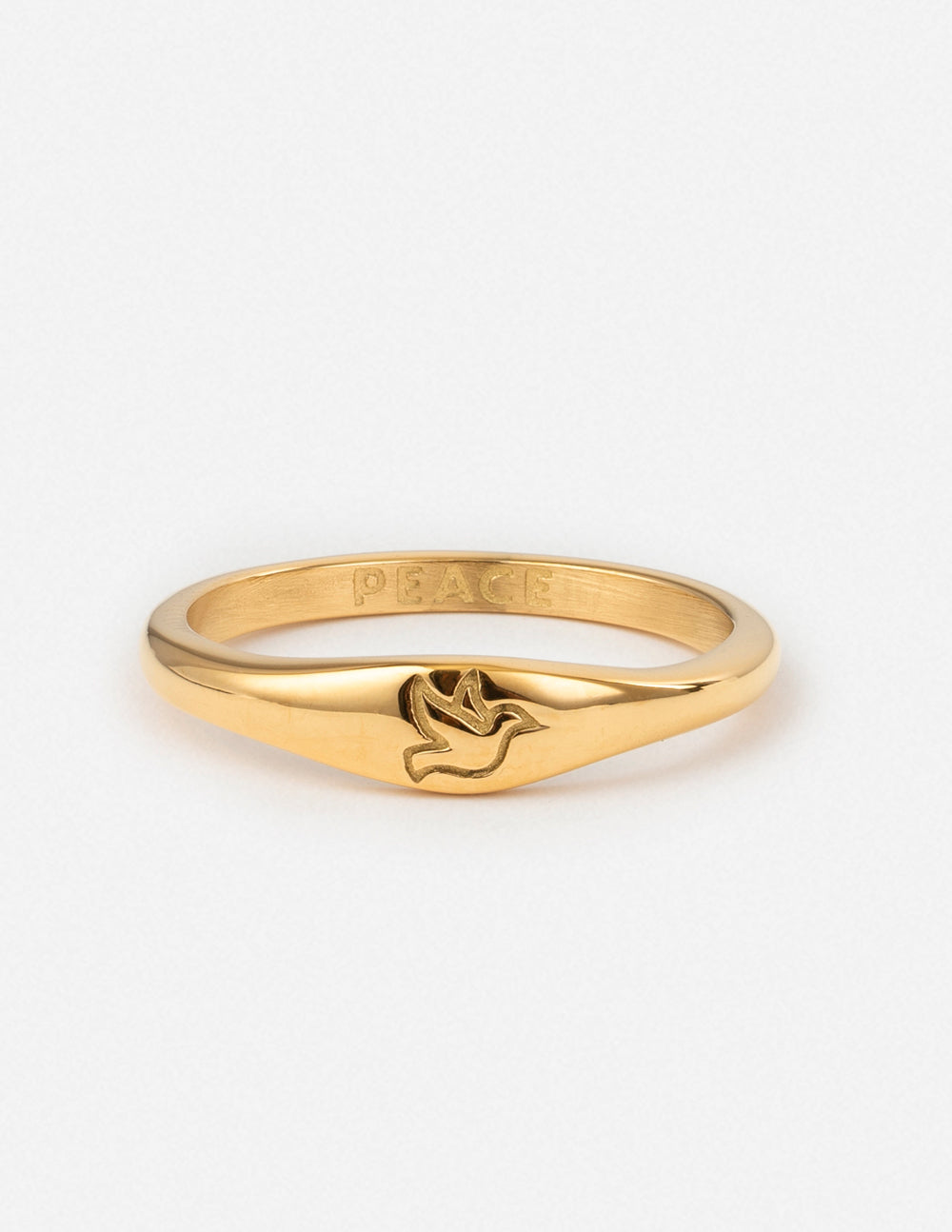 Gold peace ring with dove motif, engraved 'PEACE' on inner band