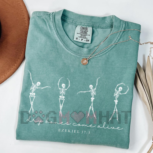 Turquoise T-shirt with white dancing skeletons graphic and “dry bones come alive” text
